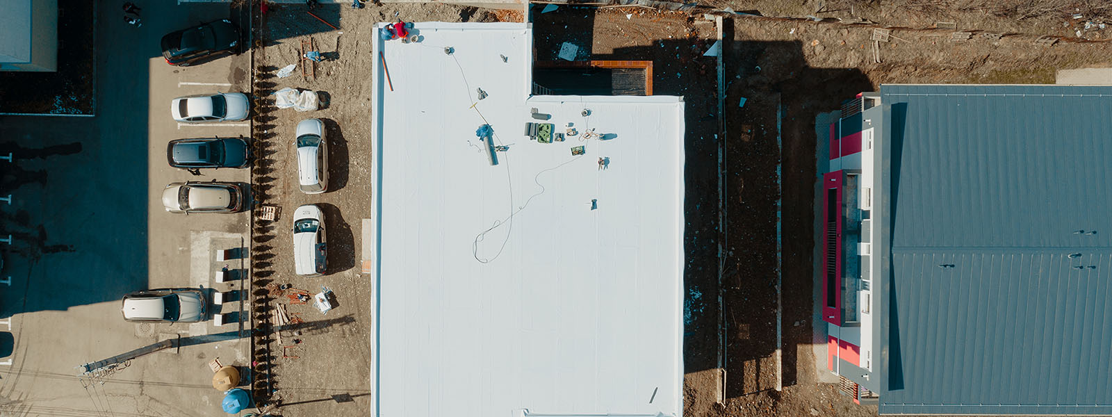 Top View Of A Commercial Building's Roof Being Worked On